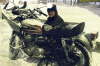 I�m not sure in this picture if Scott was fixing the fairing mount or just warming his hands up.