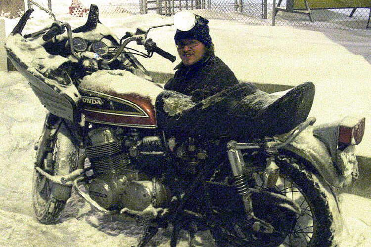 I�m not sure in this picture if Scott was fixing the fairing mount or just warming his hands up.